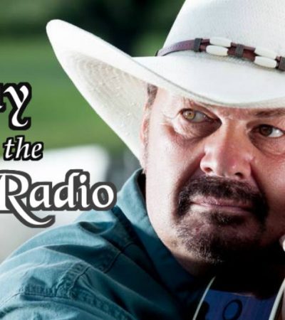 richard lynch wearing blue jean shirt and white cowboy hat