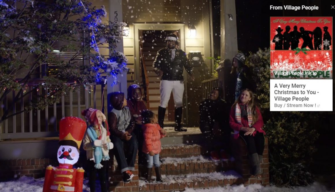 village people standing on porch with snow and children