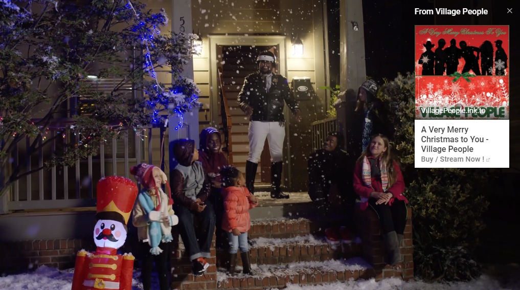 village people standing on porch with snow and children